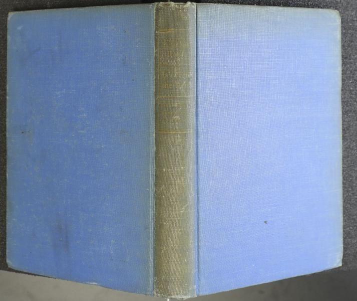Faded blue cloth boards with gold lettering on spine.